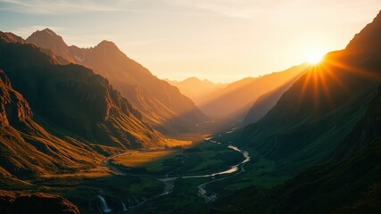 Obraz premium Golden rays of the setting sun illuminate a winding river in a majestic mountain valley