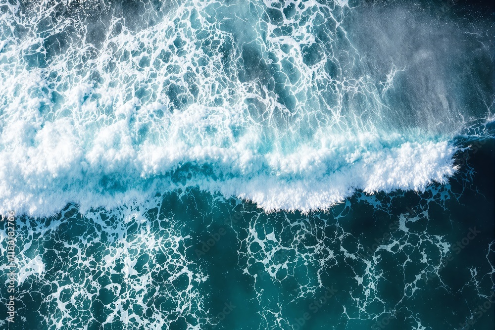 Poster Aerial view of ocean waves crashing, with white foam patterns and deep teal water in a bright and natural background.
