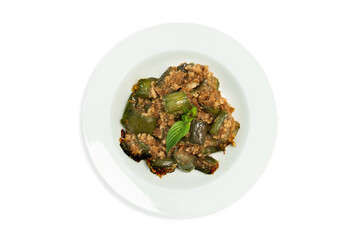 Stir-fried long eggplant (aubergine) with minced pork, on isolated white background. Top view.