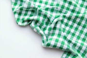 Green gingham fabric draped on white background.