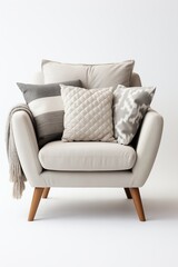 Fototapeta premium Cozy modern armchair decorated with pillows, perfect for a stylish living room ambiance.