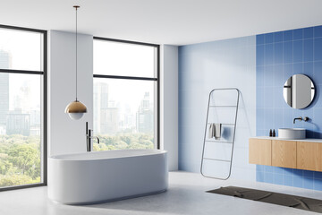 Modern bathroom interior with freestanding bathtub, wooden vanity, and blue tiled wall, featuring large windows with cityscape views. 3D Rendering