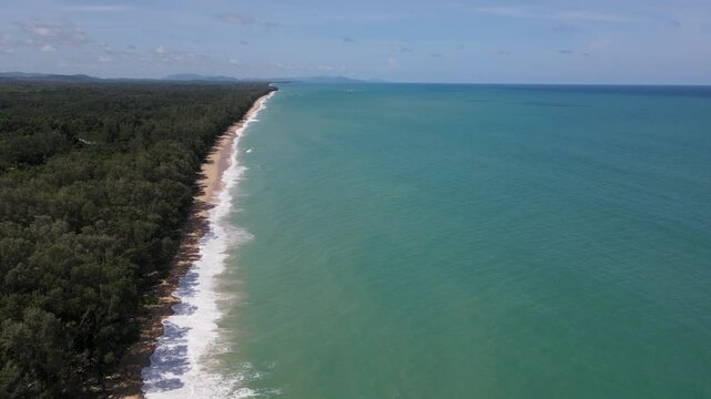 Beautiful beach with white sand turquoise ocean and blue sky with clouds on Sunny day Summer tropica aerail view.