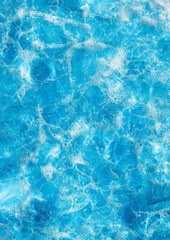 Fototapeta premium A Captivating Abstract Background Showcasing the Pure Turquoise Texture of Ocean Waves and Gentle Foam, Perfect for Creating Stunning and Serene Vertical Wallpapers. Generative Ai