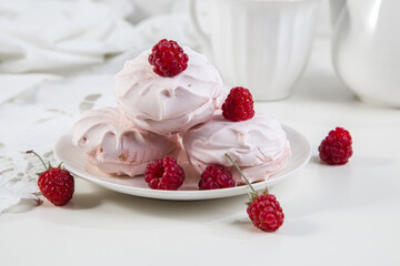 Marshmallow cookies with fresh raspberries for tea, selective focus