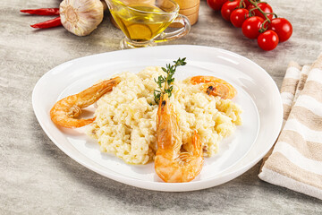 Italian risotto with prawn served thyme