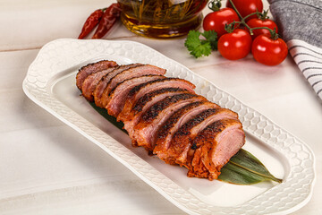 Sliced duck breast baked with cherry