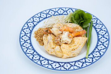 Prawn Pad Thai, Fried noodle Thai style with prawns, Fried Thai Noodle with Shrimp Wrapped in Egg on white background, Thaifood, ผัดไทยกุ้งสดห่อไข่, ผัดไทยกุ้งสด, อาหารไทย