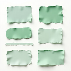 Naklejka premium A collection of torn paper shapes in soft green hues, perfect for creative design projects.