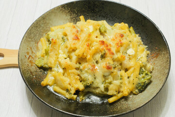 Gratin (doria) made with vegetables, macaroni, cheese and rice. Looks warm and delicious