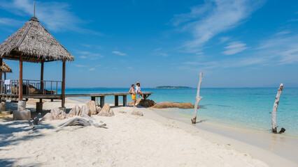 Explore the serene beauty of Koh Munnork Island in Rayong, Thailand under bright blue skies