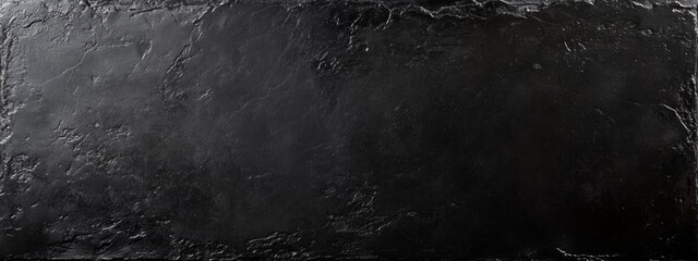 Sleek Black Surface, a smooth dark texture with a polished finish, exuding elegance through subtle light reflections.