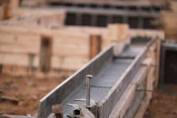 Construction of pile-grillage foundation. Monolithic foundation with metal reinforcement. Monolithic concrete foundation. House construction