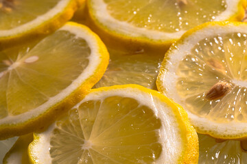 Closeup of sliced lemon textured background