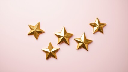 Obraz premium Golden stars scattered on a light pink background, creating a festive and celebratory atmosphere.
