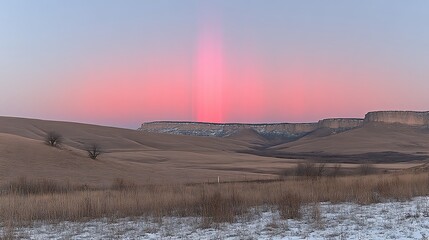 Pink Sunset Light Illuminates Rolling Hills and Cliffs