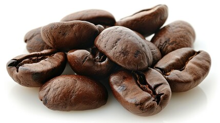 A collection of dark roasted coffee beans arranged on a white background.