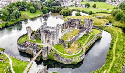 Aerial View of a Historic Caerphilly Castle Surrounded by a Reflective Moat