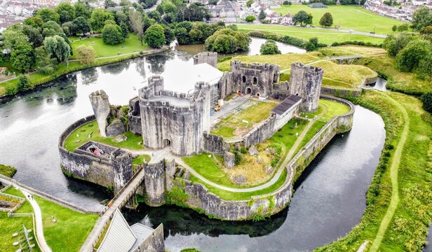 Aerial View of a Historic Caerphilly Castle Surrounded by a Reflective Moat
