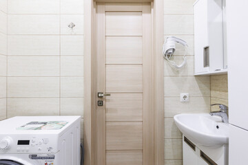 modern bathroom room with toilet and washing machine