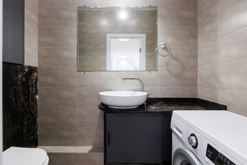 modern bathroom room with toilet and washing machine