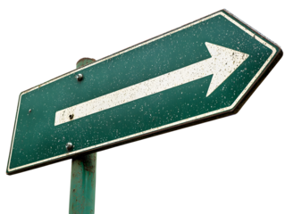 Green Road Sign With White Arrow Pointing the Direction