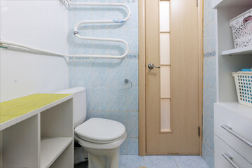 modern bathroom room with toilet and washing machine