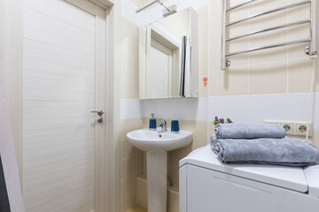 modern bathroom room with toilet and washing machine