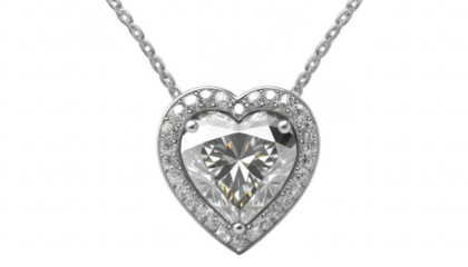 A dazzling heart-shaped diamond necklace, with diamonds reflecting in a soft circular glow, hanging on a silver chain, only on a transparent PNG background