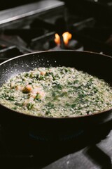 Shrimp and Herb Risotto on the Stove


