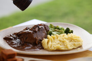 Steak with Mushroom Gravy, Mashed Potatoes, and Broccoli