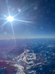 Majestic View of the Alps Seen from an Airplane Window at High Altitude

