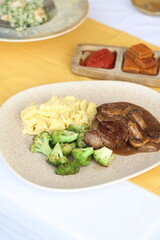 Steak with Mushroom Gravy, Mashed Potatoes, and Broccoli