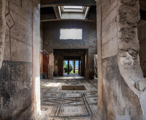 Pompei, Italy - 22 march 2024 - interior of a house with mosaic floor at the ancient Roman city