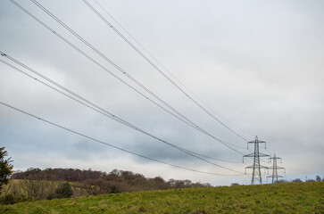 National grid electricity pylons forming a leading line across the countryside.