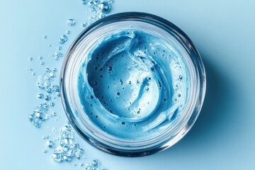 Fototapeta premium Transparent gray blue cream gel cosmetic texture with bubbles on a blue backdrop