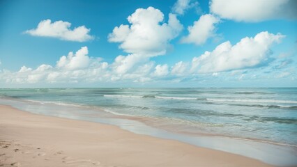 Obraz premium Serene tropical beach, turquoise ocean waves, soft sandy shore, fluffy white clouds, clear blue sky, peaceful coastline, gentle surf, tranquil seascape, sun-drenched landscape, idyllic vacation scene,