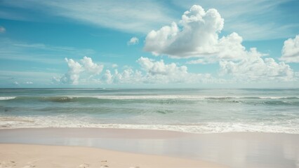 Fototapeta premium Serene tropical beach, turquoise ocean waves, soft sandy shore, fluffy white clouds, clear blue sky, peaceful coastline, gentle surf, tranquil seascape, sun-drenched landscape, idyllic vacation scene,