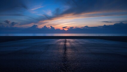Dark blue sunset over asphalt with subtle clouds