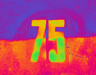 Bright number 75 on textured background. Seventy-five