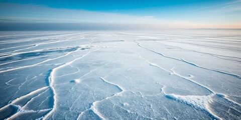 Cracks on the icy surface of Lake Baikal create a stunning abstract pattern in varying shades of blue, natural, abstract background, ice
