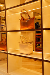 Elegant handbags displayed in a stylish boutique showcasing modern fashion accessories