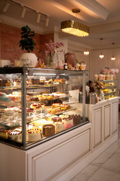 Luxurious Pastry Display in a Modern Dessert Cafe
