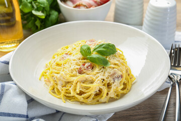 Delicious pasta Carbonara served on table, closeup