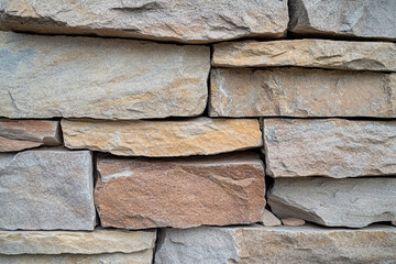 Close-up of sandstone with subtle layering and natural colors