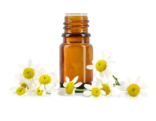 Bottle of essential oil and chamomile flowers isolated on white