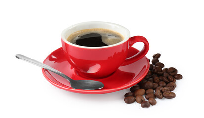 Red cup of aromatic coffee, saucer, spoon and beans isolated on white