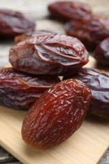Many tasty dried dates on table, closeup
