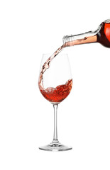 Pouring wine into glass on white background