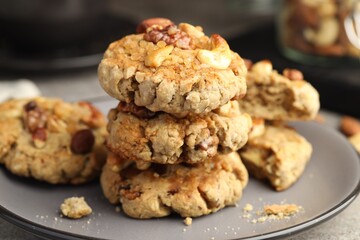 Tasty cookies with nuts on table, closeup